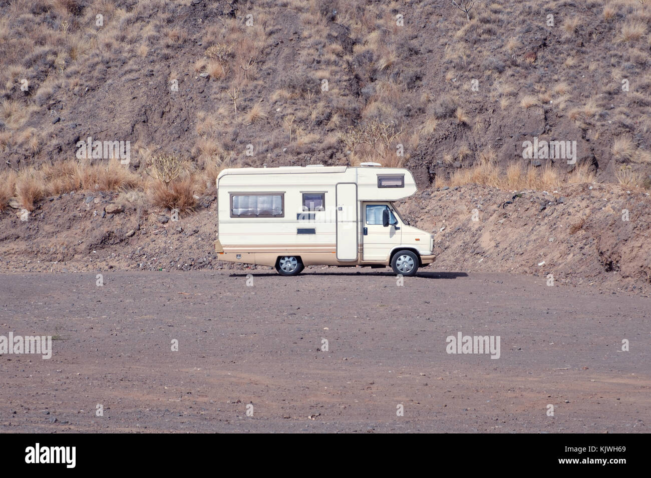 vintage camping bus, rv camper in desert landscape, Stock Photo