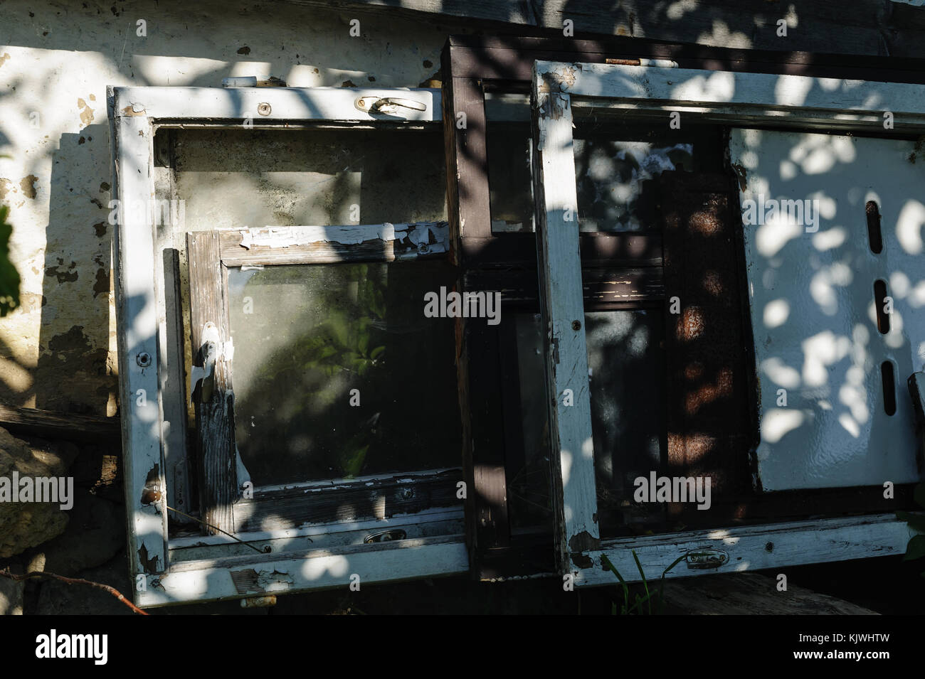 Old window frames are near the wall Stock Photo Alamy