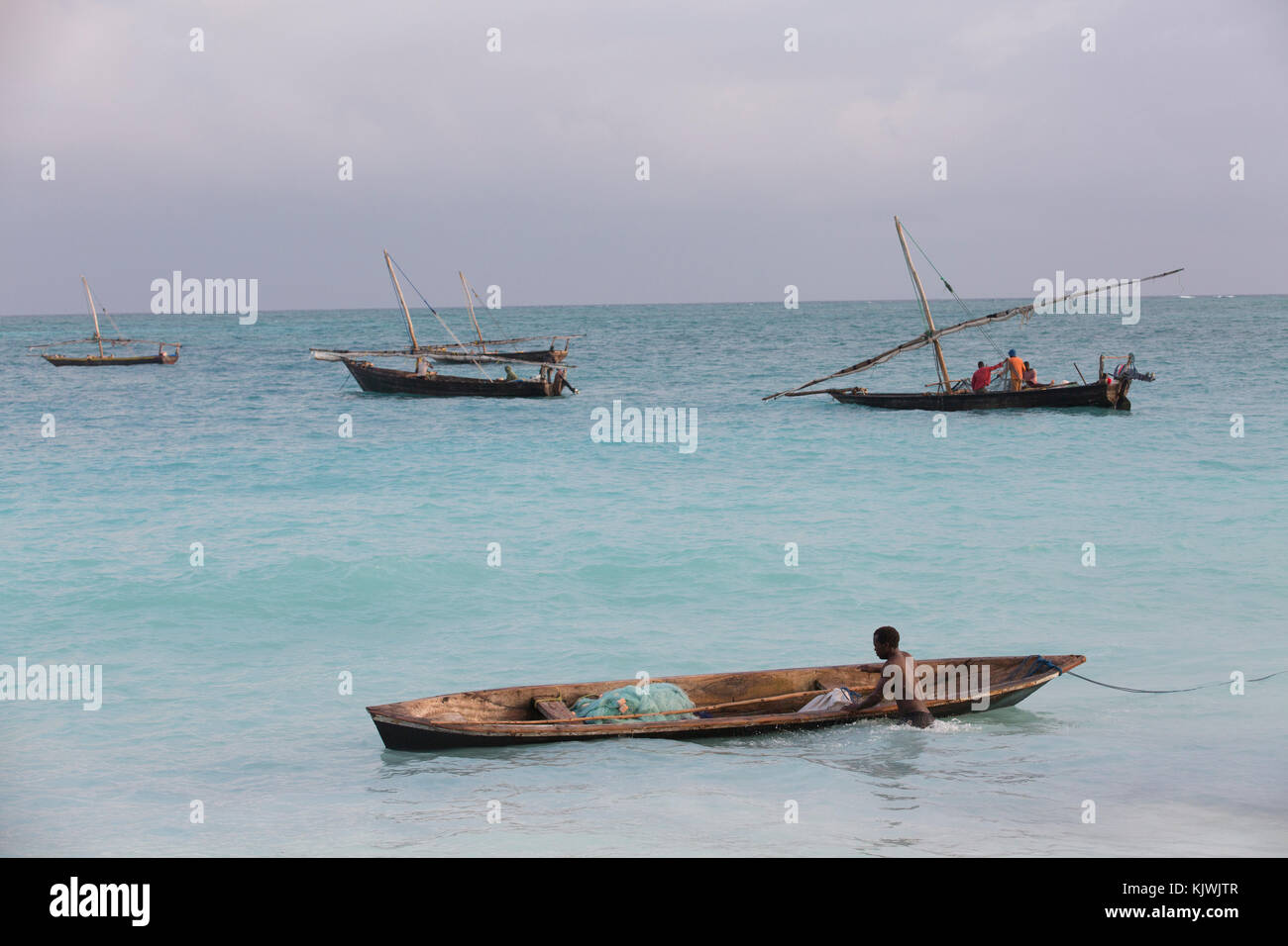 Nungwe, Zanzibar, Tanzania; fishermen bring in their catch. Stock Photo