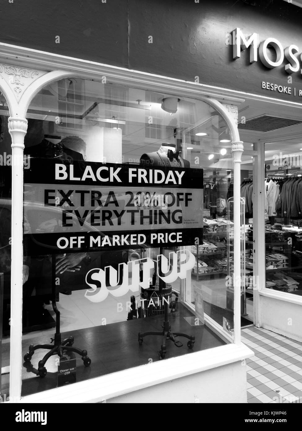 Moss Bros Black Friday signs in high street stores advertising price discounts Stock Photo Alamy
