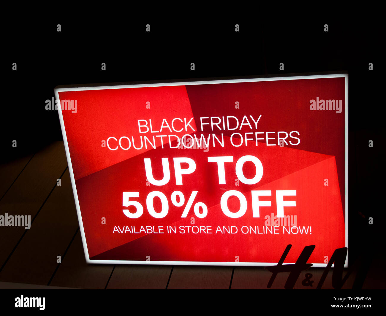 Black Friday signs in high street stores advertising price discounts Stock Photo Alamy