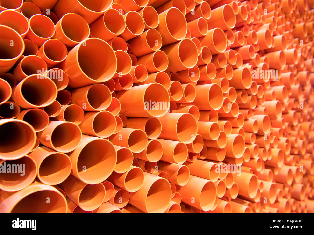 PVC pipes stacked in construction site Stock Photo - Alamy