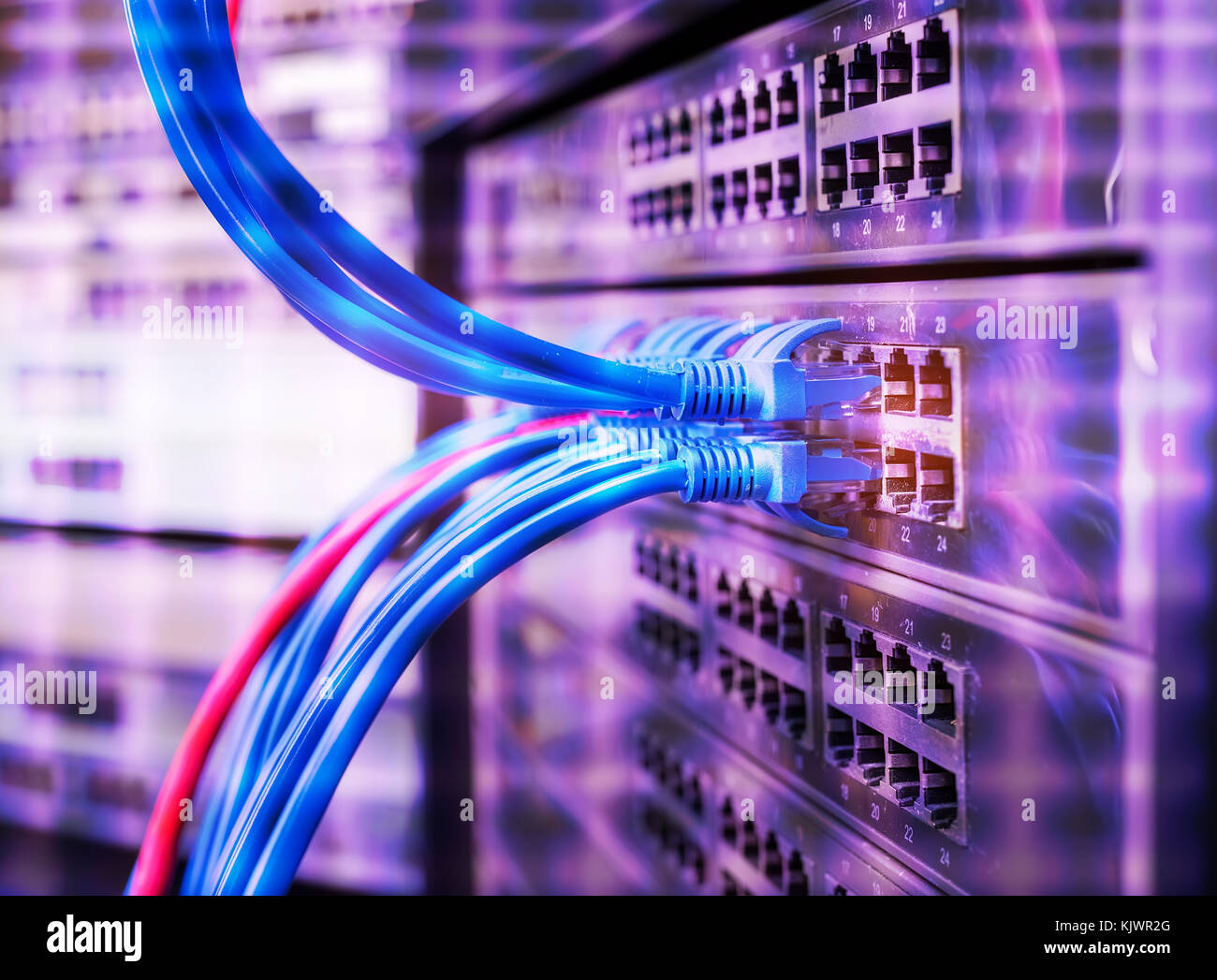 Network panel switch and internet cable in data center. Stock Photo