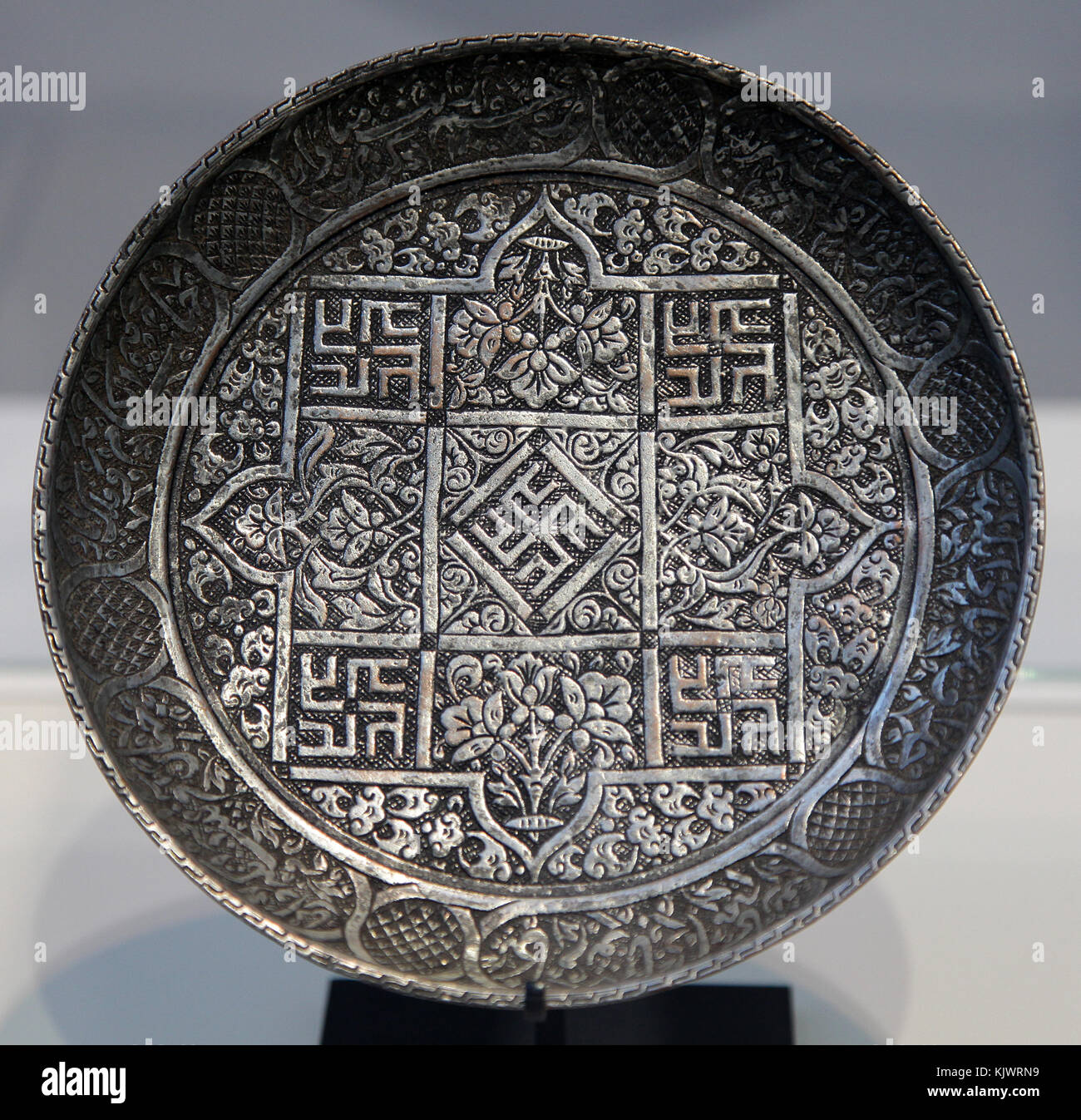 Copper alloy Dish with the name of the imam Ali in geometric Kufic script with vegetal decorations.Khurasan.Iran c.1500 Stock Photo