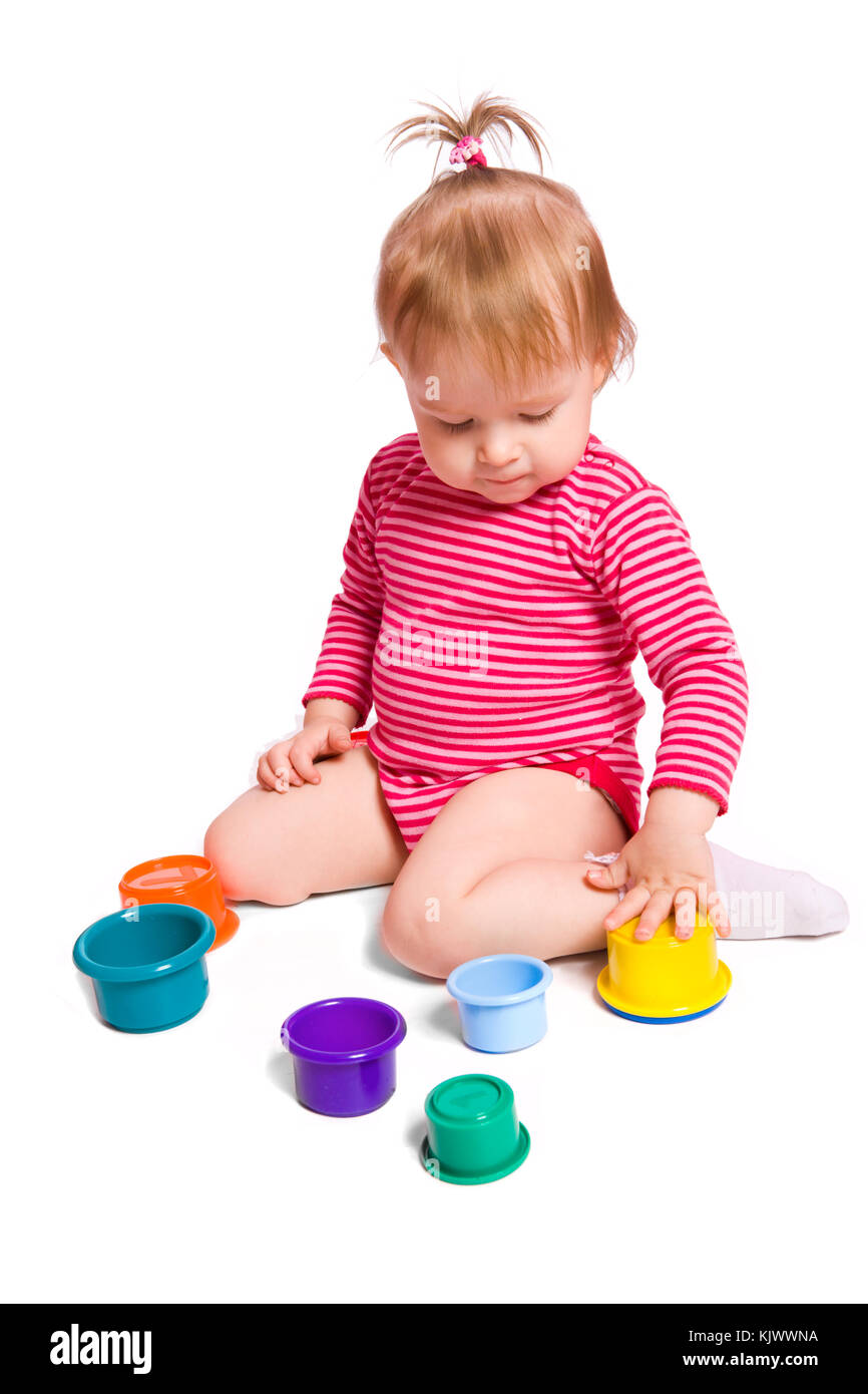 Little Girl playing with colorful toys isolated on white Stock Photo ...