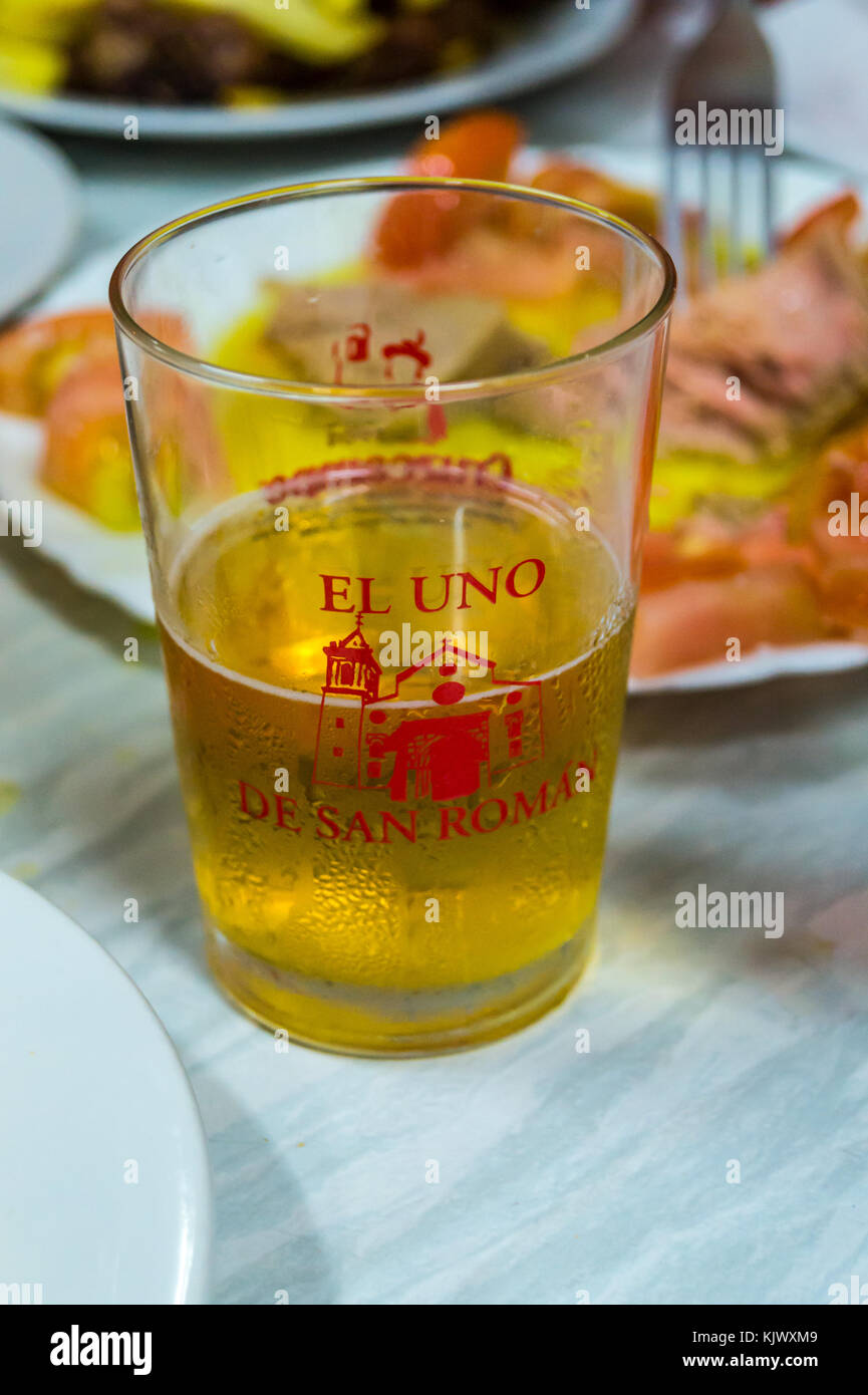 A glass of white wine at El Uno de San Roman tapas bar, Plaza San Roman, Seville, Andalucia, Spain Stock Photo