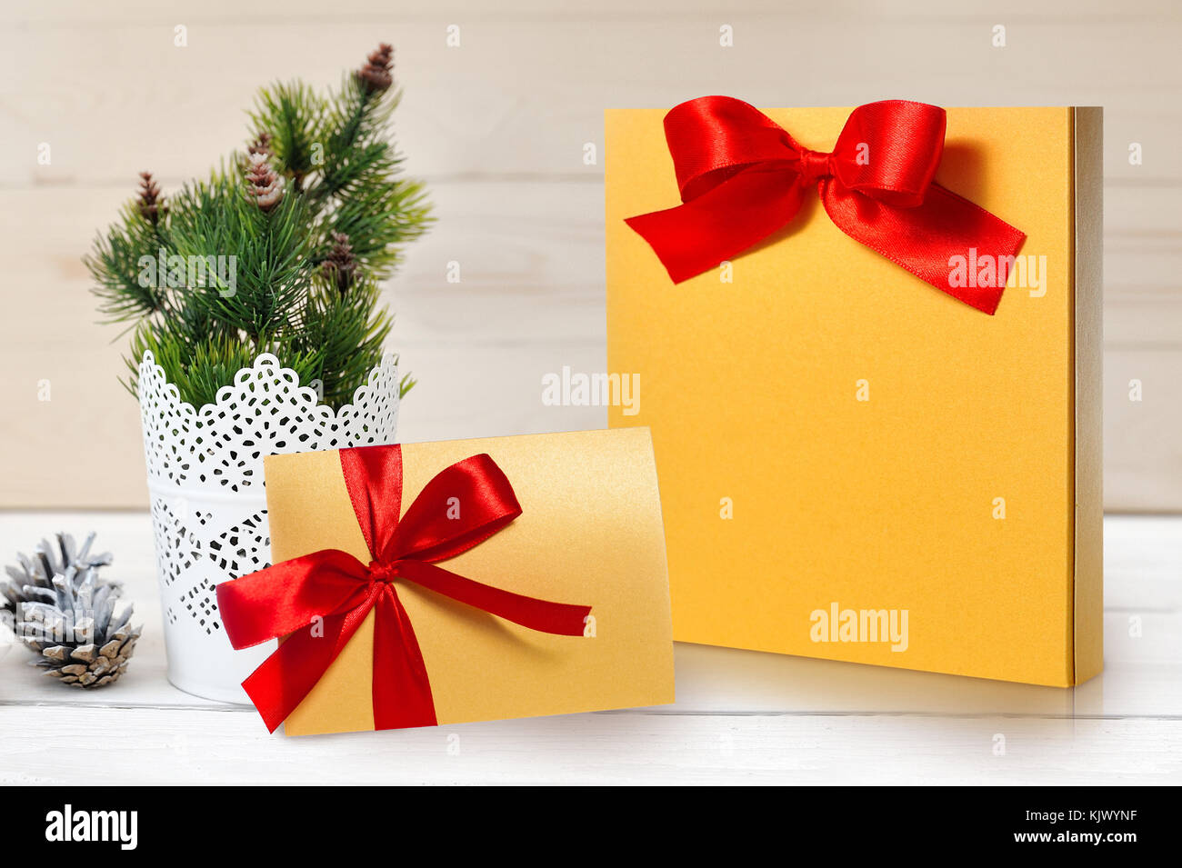 Mockup christmas package and letter with a red bow with place for your text Stock Photo