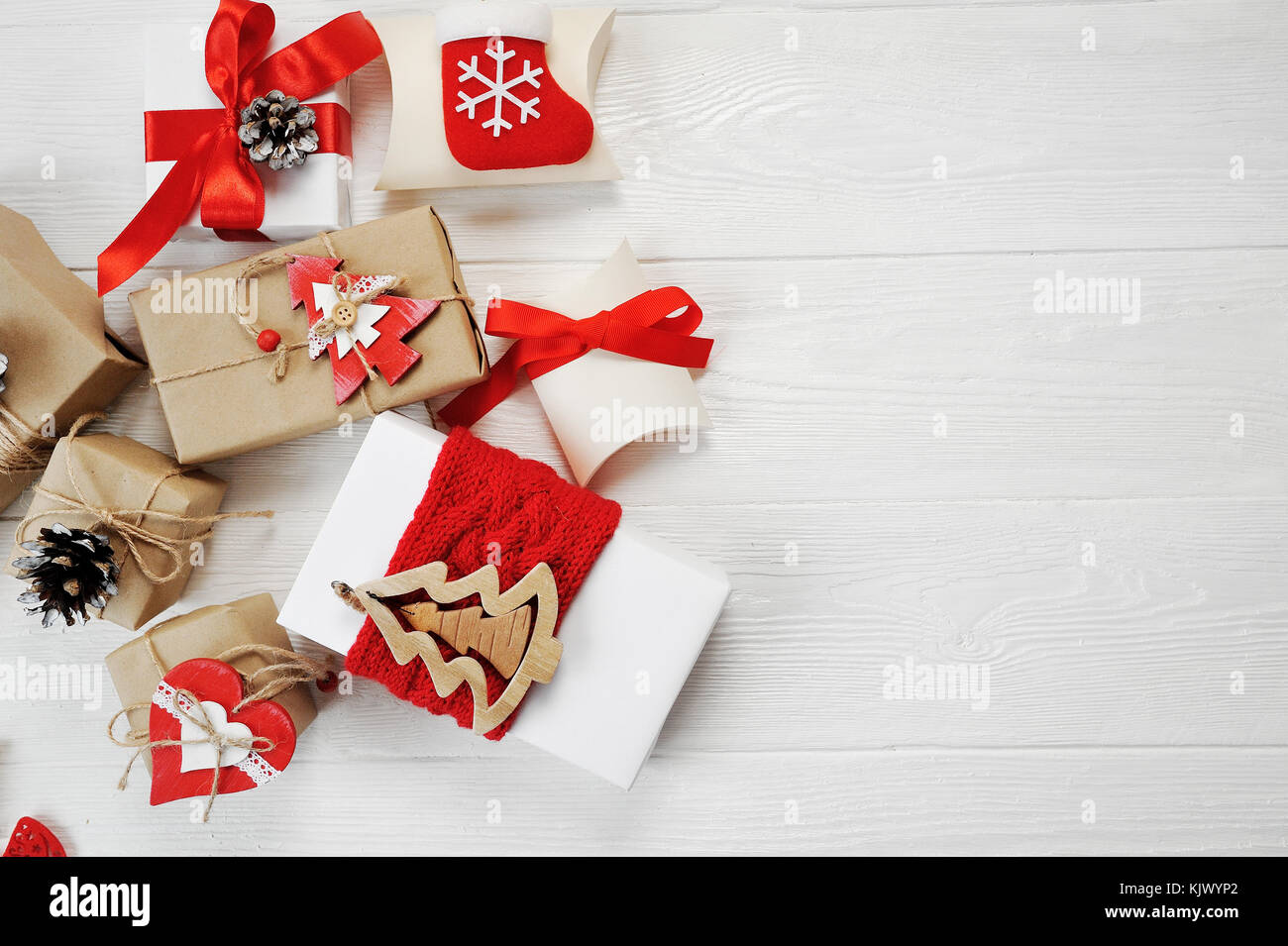 Mockup christmas boxes decorated stylishly on a white wooden background with space for your text. Flat lay, top view photo mock up Stock Photo