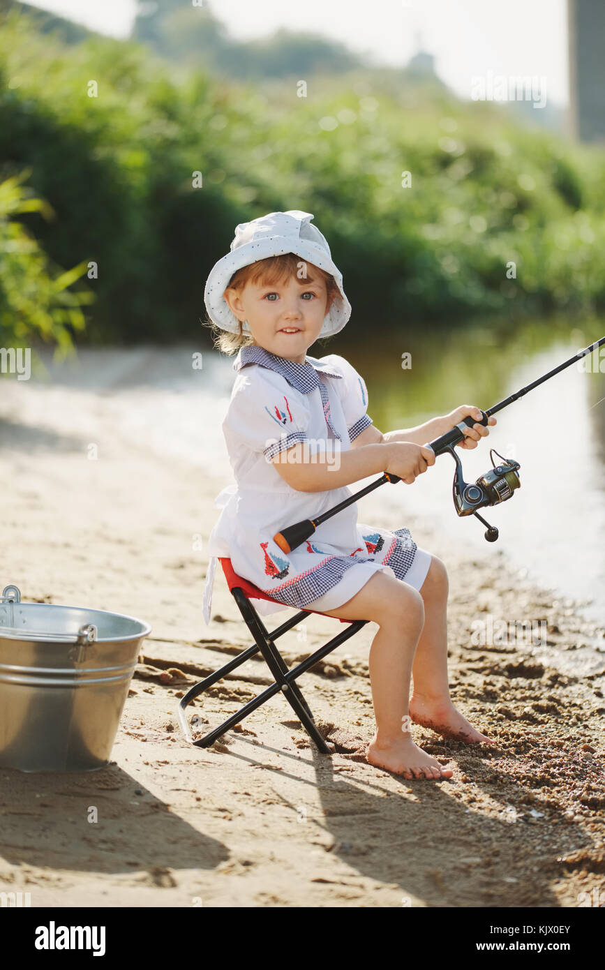 Girl Stands Shore Forest Lake Catches Fish Fishing Rod — Stock Photo ©  baxys #467272096