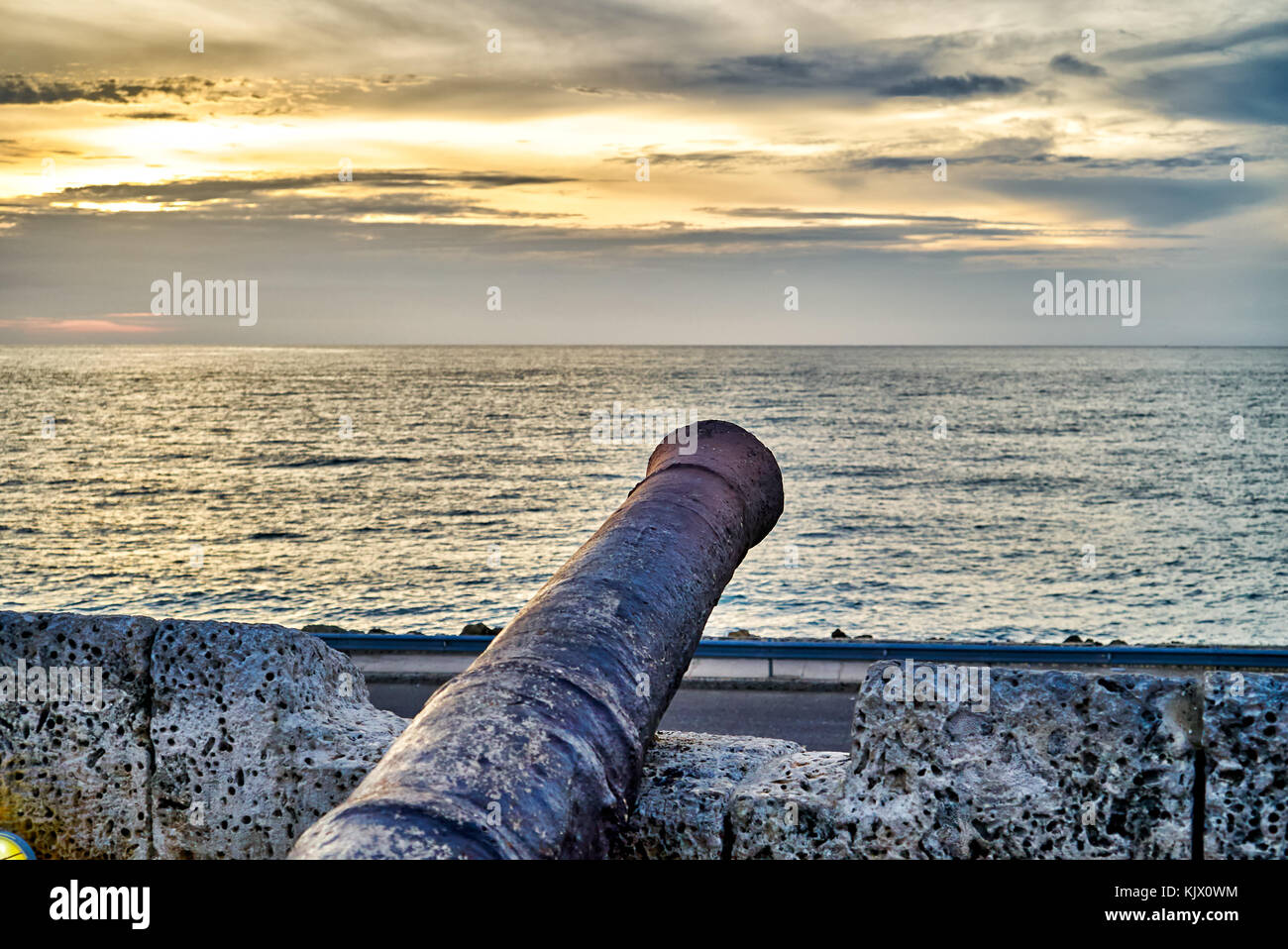 cannon and sunset at Cafe del Mar, Cartagena de Indias, Colombia, South America Stock Photo
