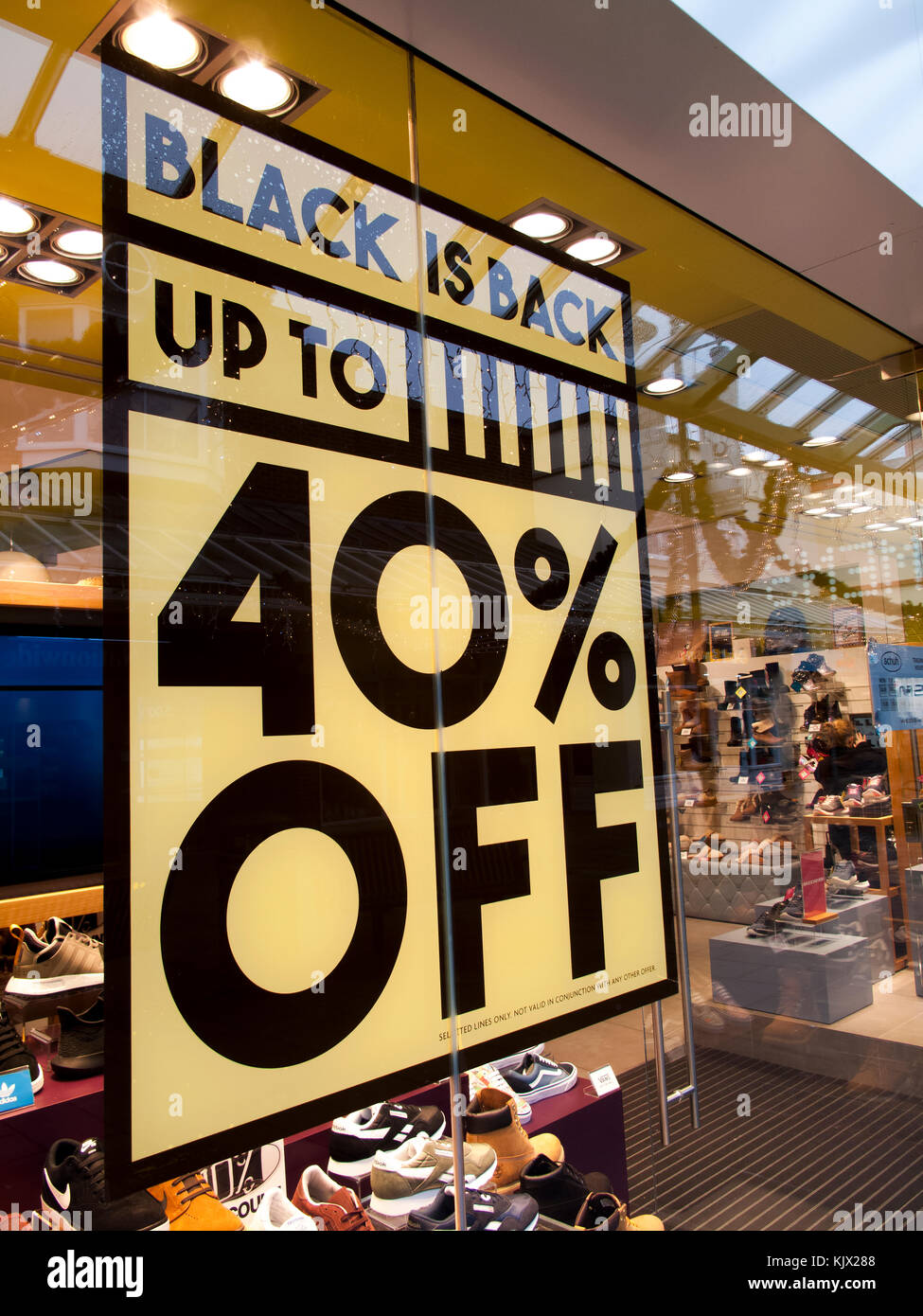 Black Friday signs in high street stores advertising price discounts