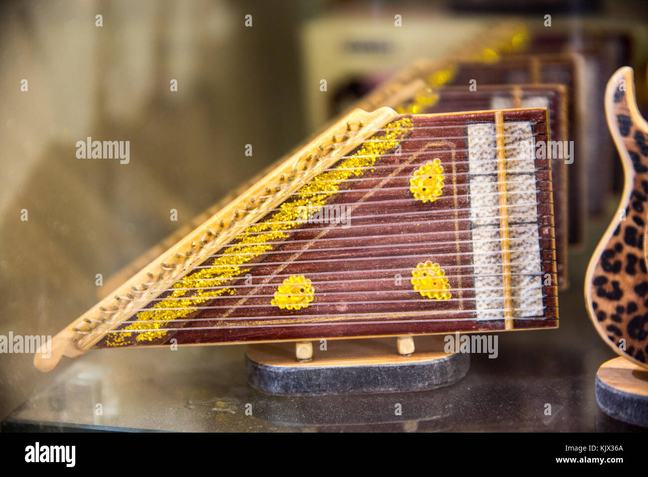 Toy Instrument from Middle East and Asia called Qanun or Kanun for sale in  Istanbul grand bazaar Stock Photo - Alamy