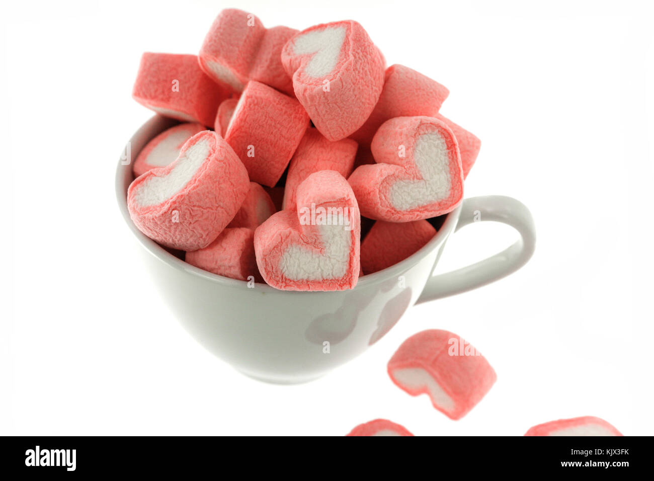 https://c8.alamy.com/comp/KJX3FK/pink-heart-shaped-marshmallows-in-the-white-cup-isolated-on-white-KJX3FK.jpg