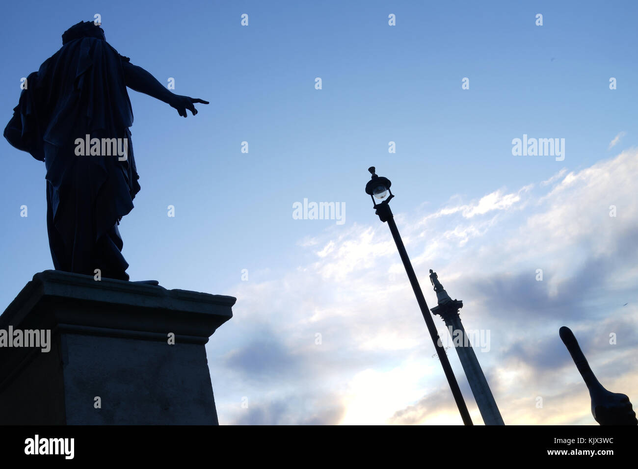 James II statue on the National Portrait Gallerly lawn overlooks Nelson's Column and Trafalgar square's Fourth Plinth (David Shrigley's thumb) Stock Photo