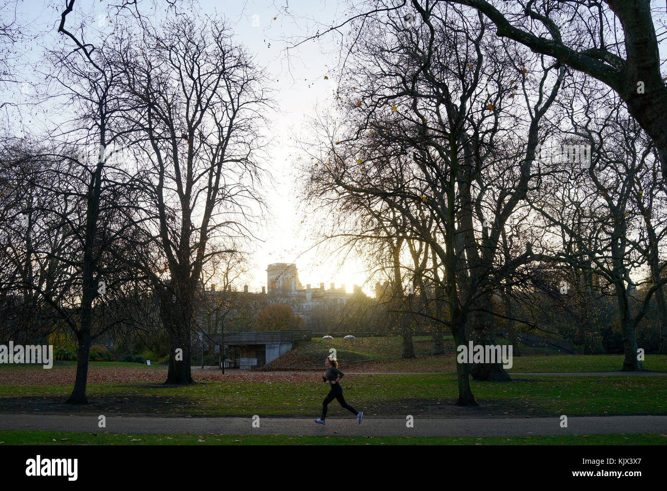 Woman jogging in St James park, London Stock Photo