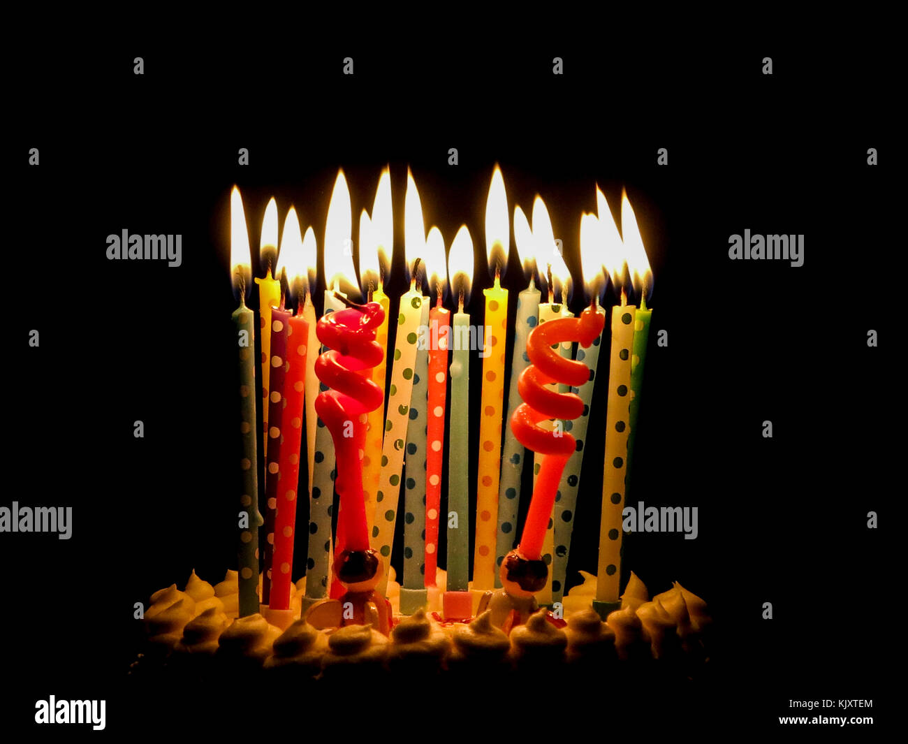 Birthday candles on a cake waiting to be blown out Stock Photo