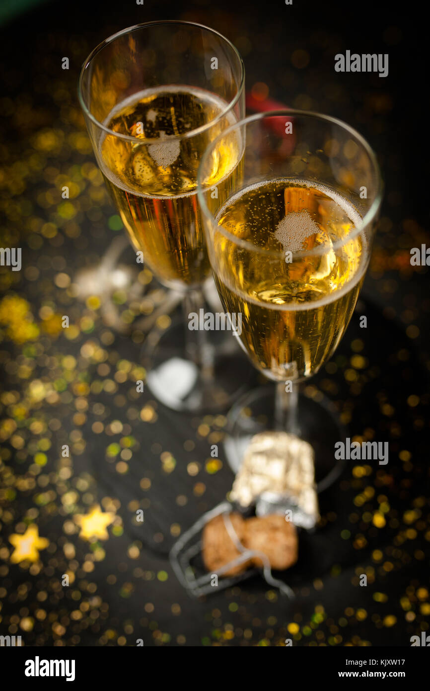 Two champagne glasses in golden glitter Stock Photo Alamy