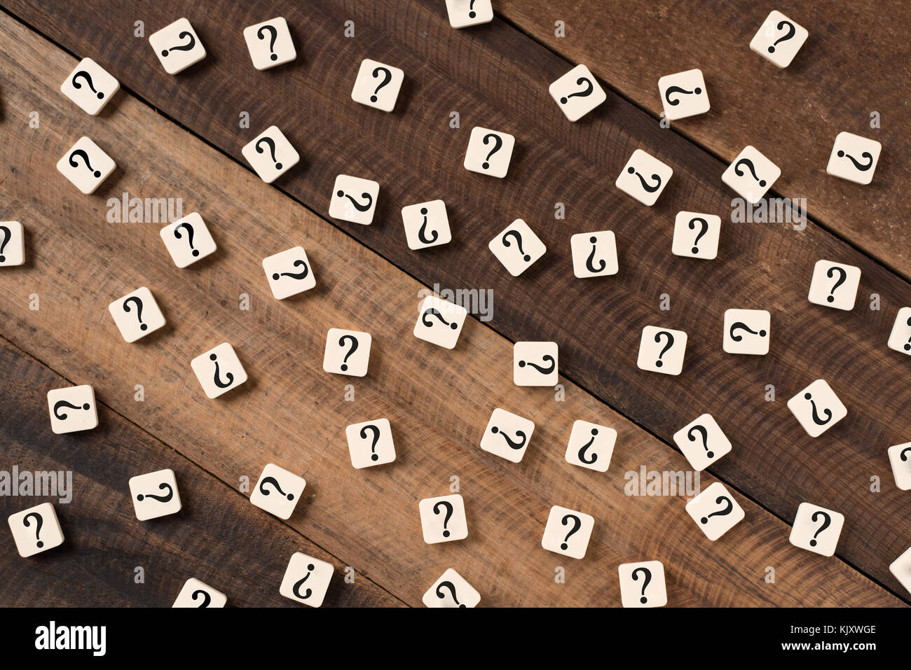 Question mark on alphabet tiles. question mark on wooden table ...