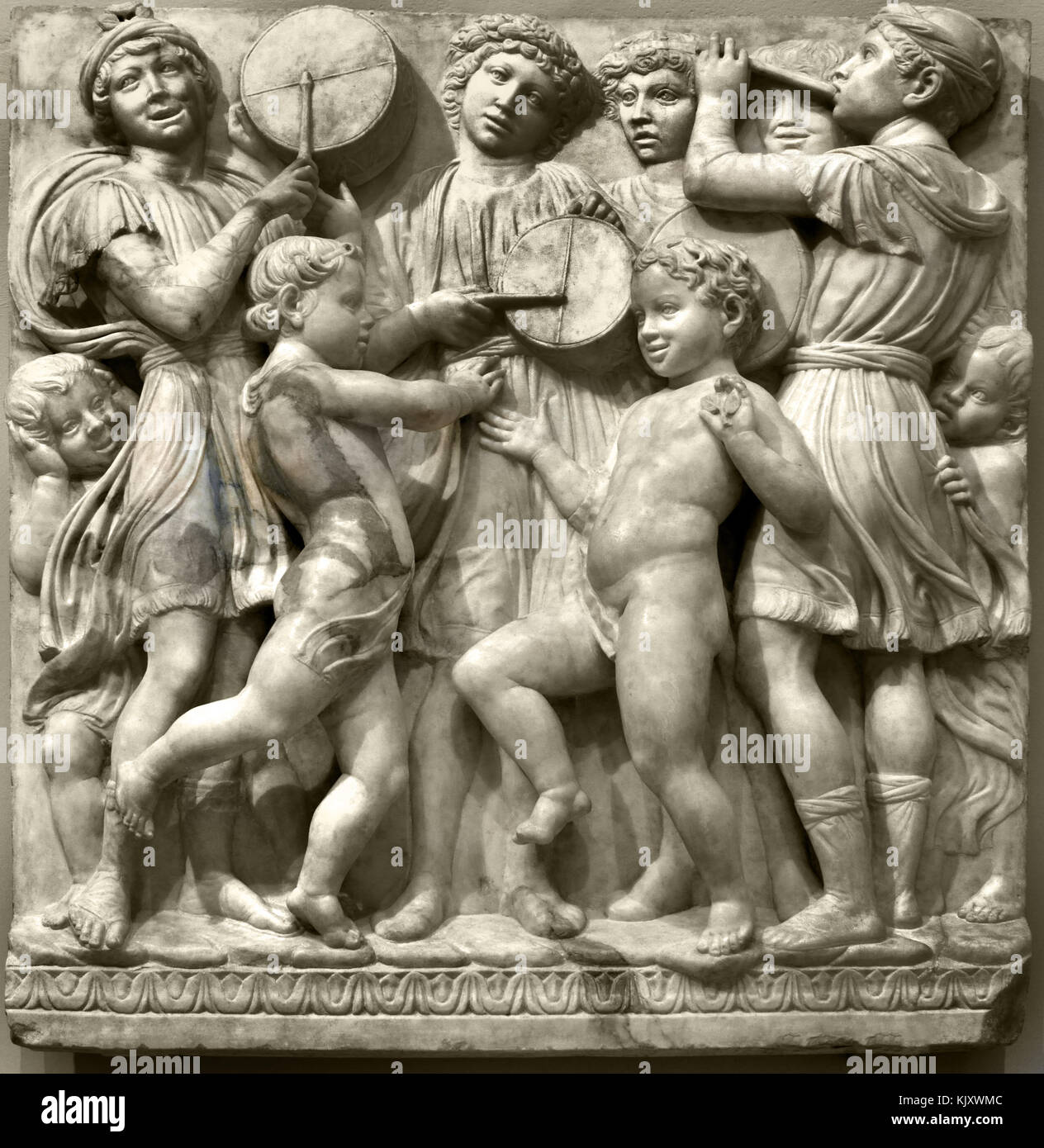 Boys playing music, illustration of Psalm 150 (Laudate Dominum).   1438' organ 1431-38 by Luca della Robbia 1399–1482, Duomo, di Firenze ( The Cattedrale di Santa Maria del Fiore of Florence - Cathedral of Saint Mary of the Flower  1336 )  Museo dell'Opera del Duomo Florence Italy Italian. Stock Photo