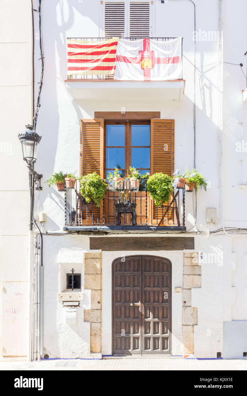 Catalan flags displayed on the balcony of a house, Sitges, Spain Stock Photo