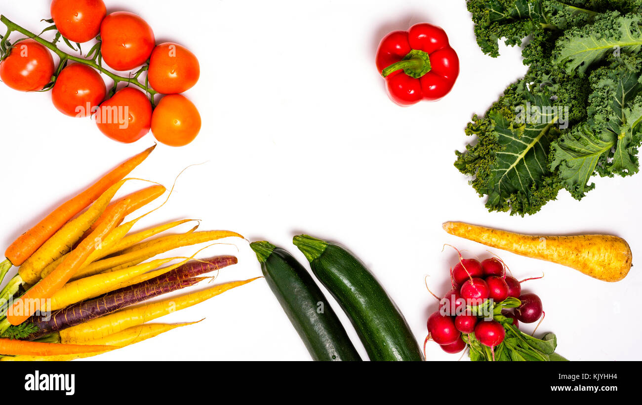Vegetables. Fresh tomatos. Colorful vegetables background. Healthy vegetable studio photo. Assortment of fresh vegetables close up. Stock Photo