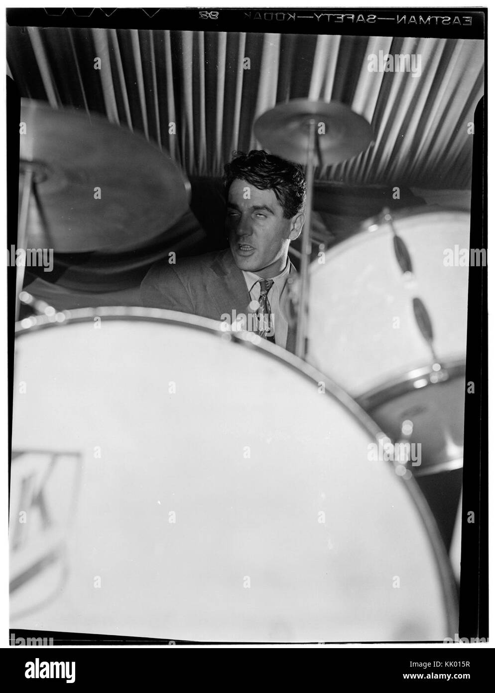This portrait of Gene Krupa, taken at the 400 Restaurant in New York in 1946, captures the famous jazz drummer during a moment in his career, reflecting his role in the jazz music scene. Stock Photo