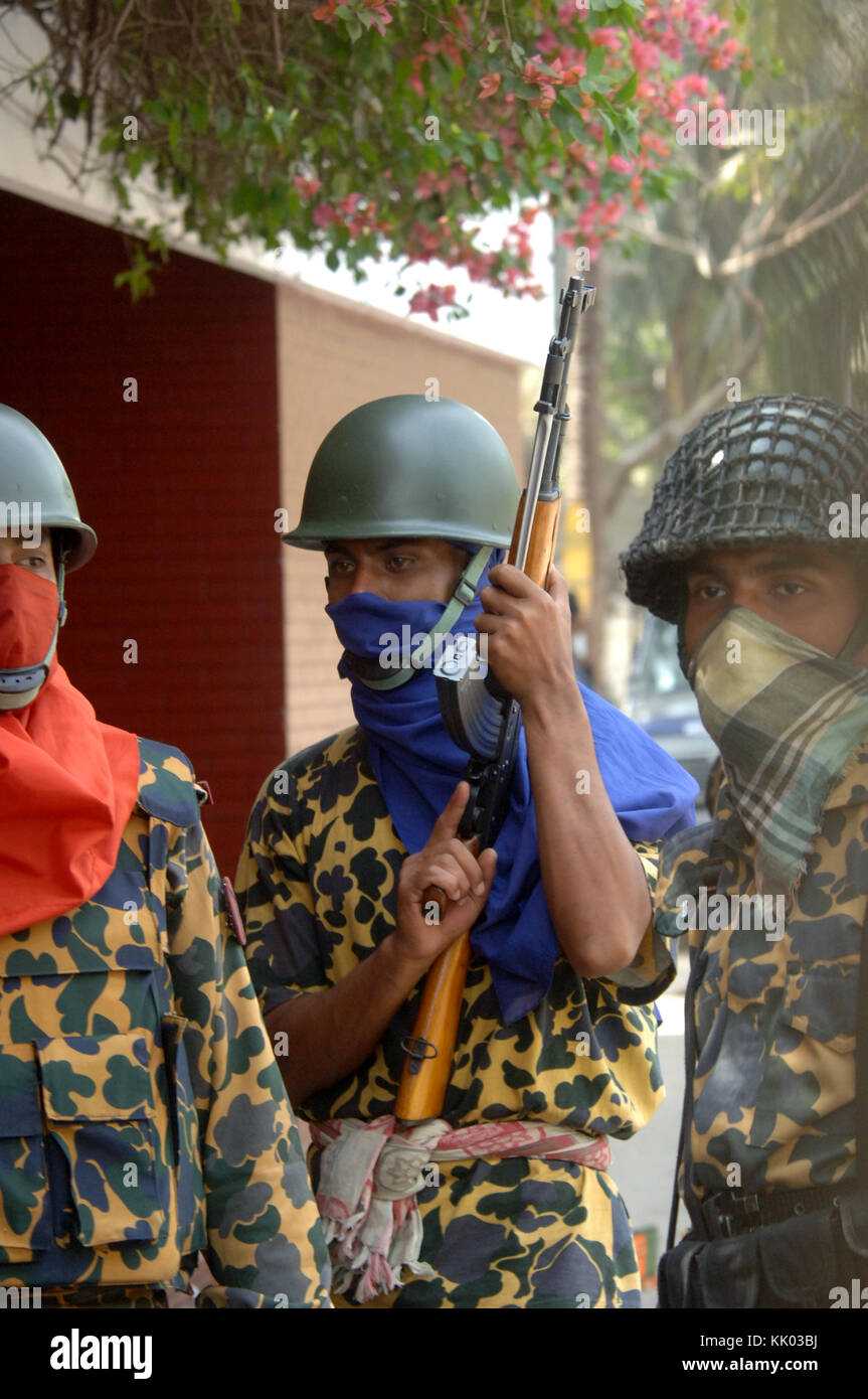 DHAKA, BANGLADESH FEBRUARY 26, 2009 Bangladesh border guards carry