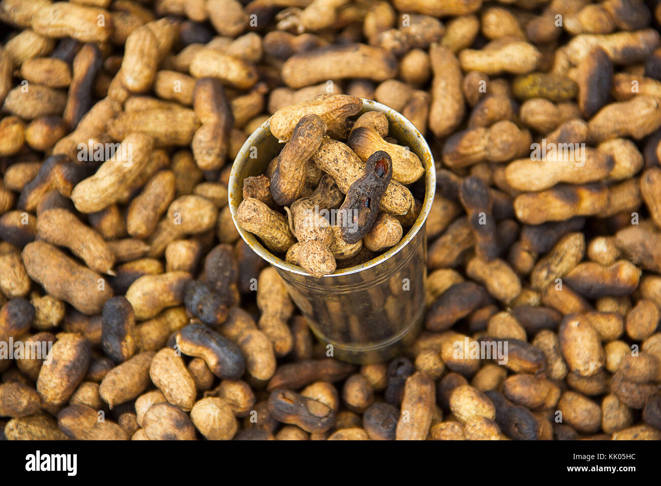 Steel glass full with fried groundnuts for sale, Narayanpur, Pune Stock
