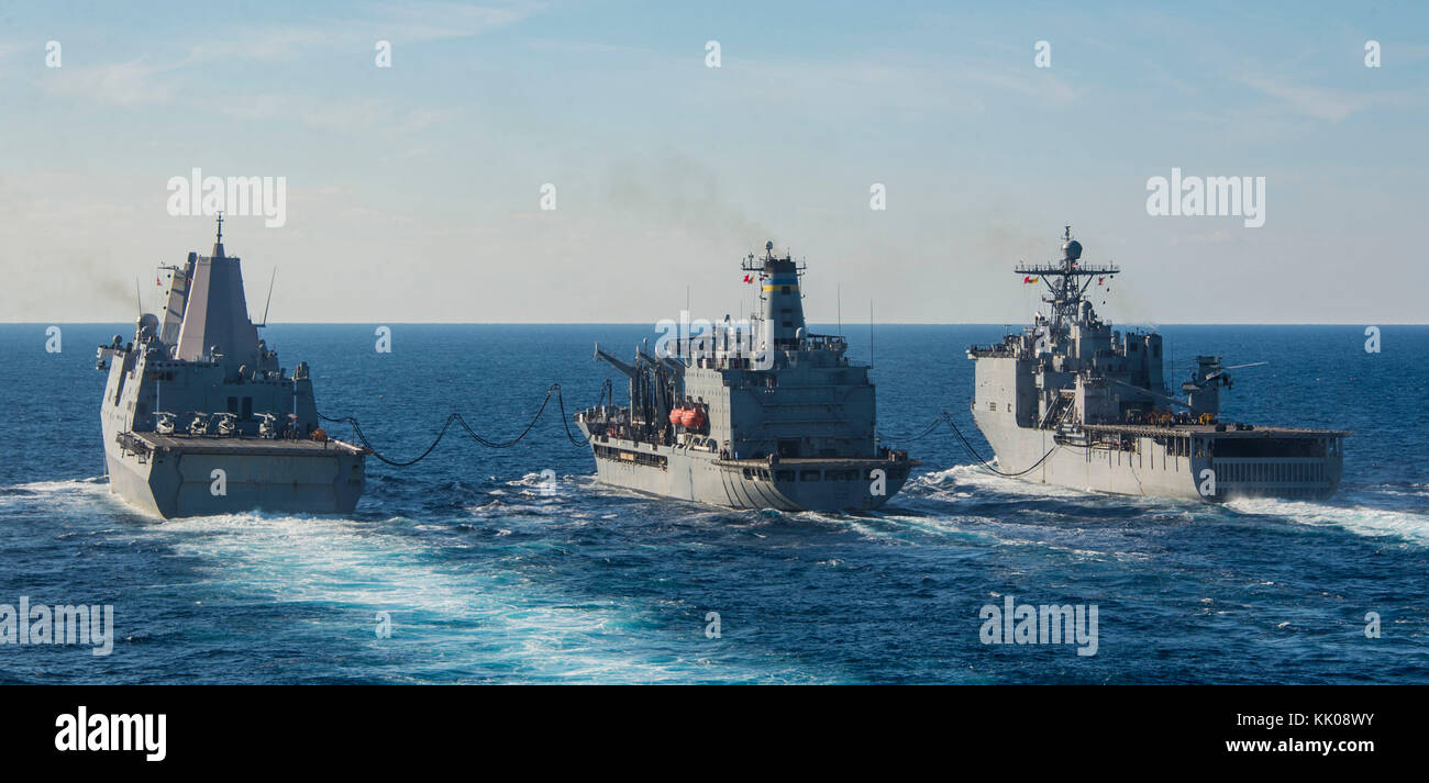 The amphibious transport dock ship USS New York (LPD 21) (left) and the amphibious dock landing ship USS Oak Hill (LSD Stock Photo
