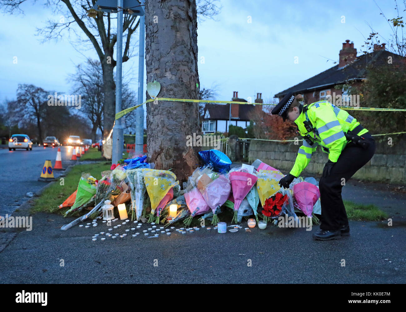 Floral tributes are left near the scene of a car crash in Stonegate