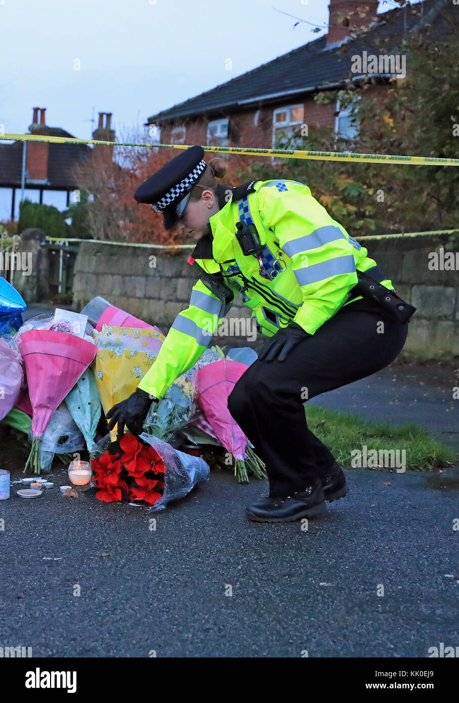 Floral tributes are left near the scene of a car crash in Stonegate