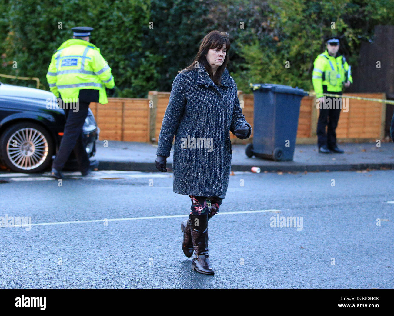 A woman, thought to be the mother of one of the victims, at the scene