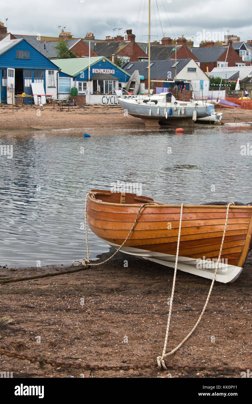 wooden boats beached at low tide at The Point in Exmouth,Devon, UK