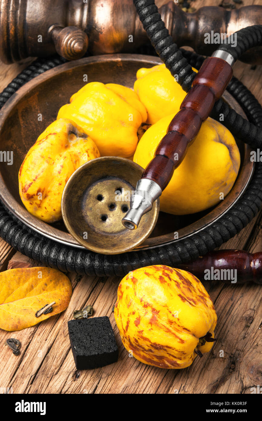 Smoking smoking hookah in Arabic style with the tobacco aroma quince Stock  Photo