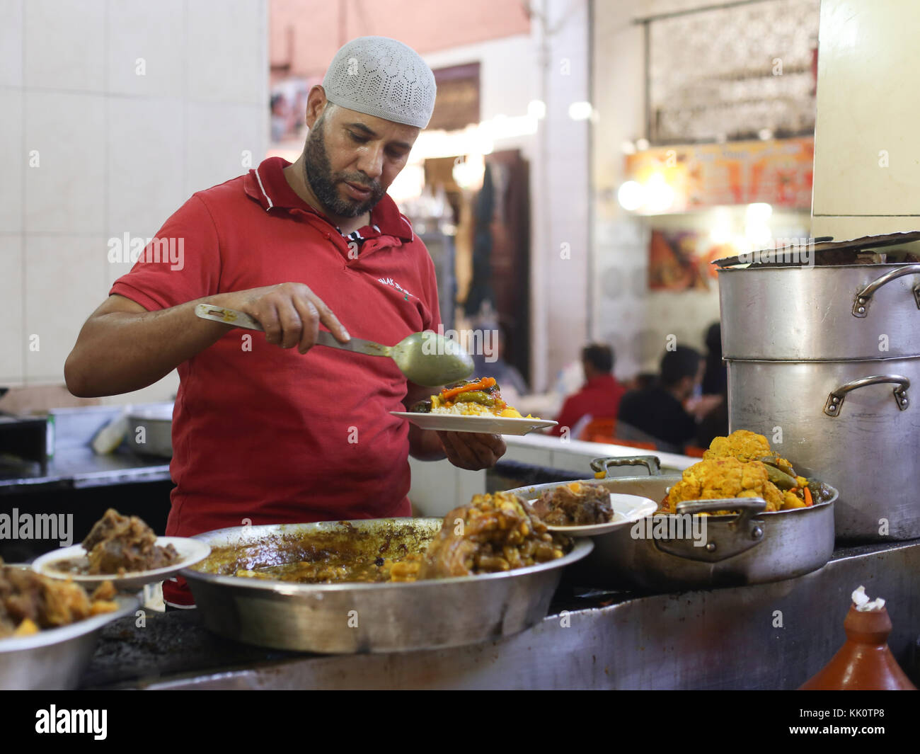 Chef preparing tajine in Marrakech, Morocco Stock Photo