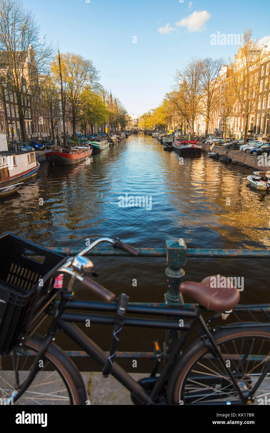 View of bicycle and canal, central Amsterdam, The Netherlands Stock Photo
