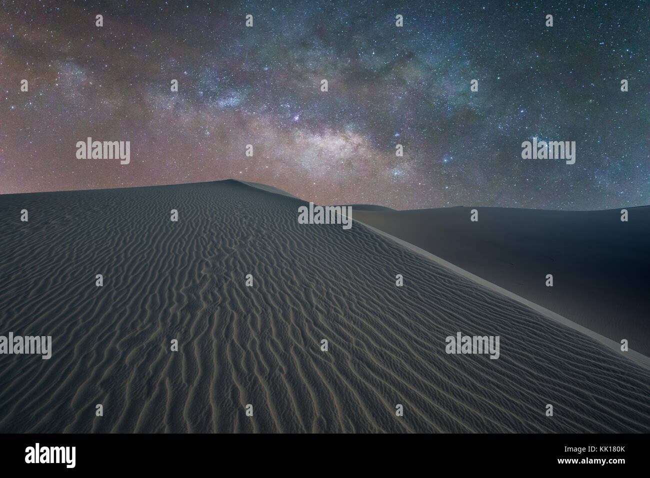 The Milky Way over sahara like sand dunes at Maspalomas early March in Gran Canaria within the Canary Isles Stock Photo