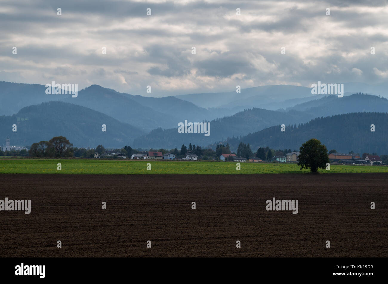 The farmlands of the Mur river valley and the mountains in the background Stock Photo