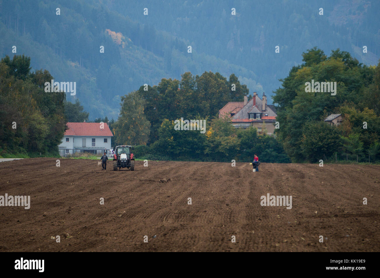 Fohnsdorf, Austria - 30.09.2017: People working a field in southern Austria Stock Photo
