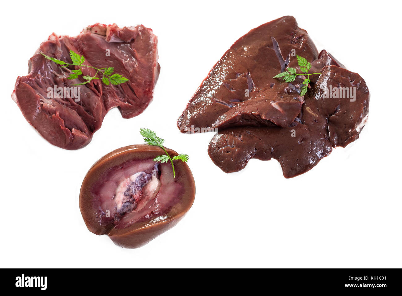 collection of raw lamb offal kidney, liver, heart a white background Stock Photo