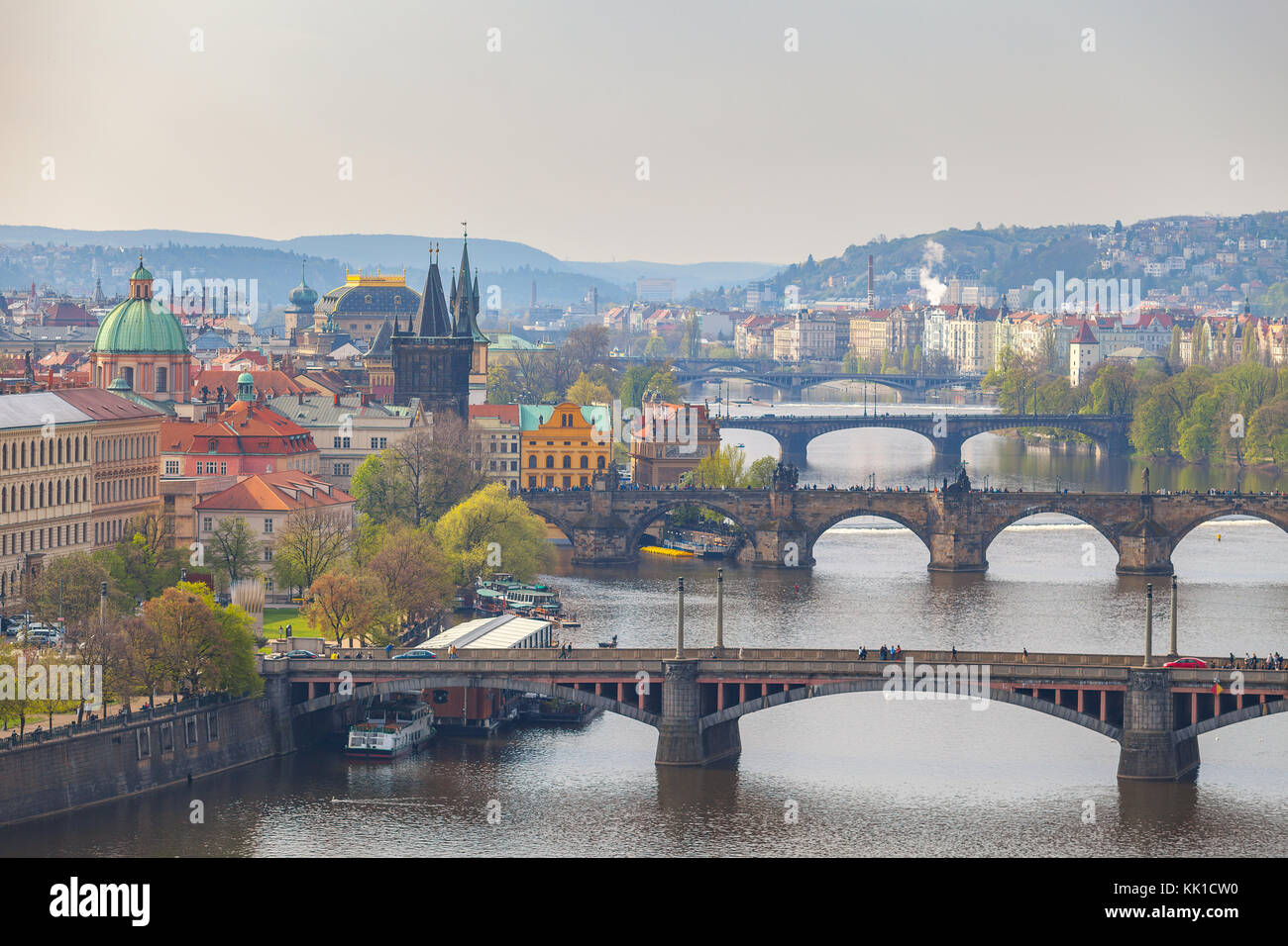 Remarkable view of Prague bridges over Vltava river with historic embankment. Daytime, spring season. Stock Photo