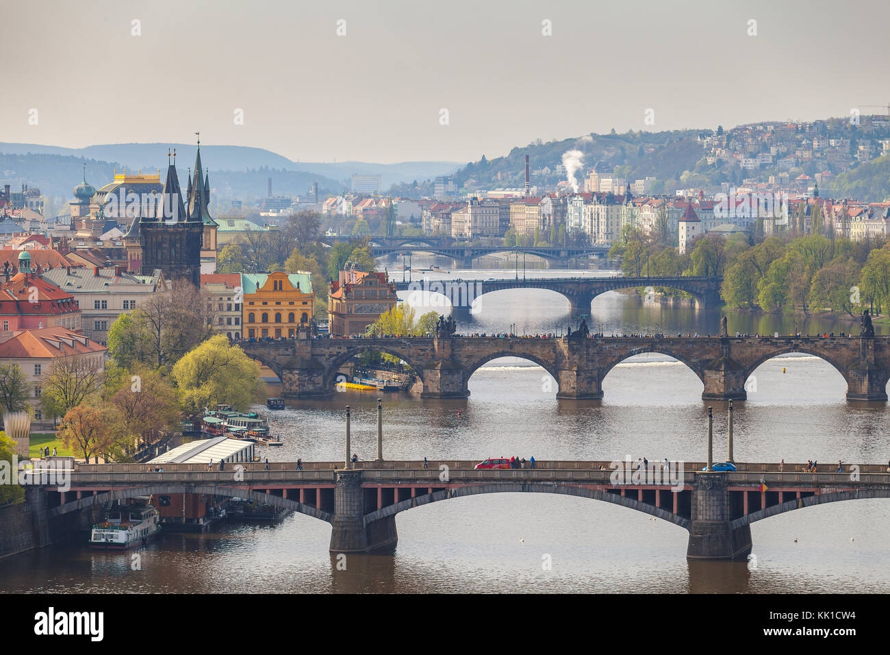 Remarkable view of Prague bridges over Vltava river with historic embankment. Daytime, spring season. Stock Photo