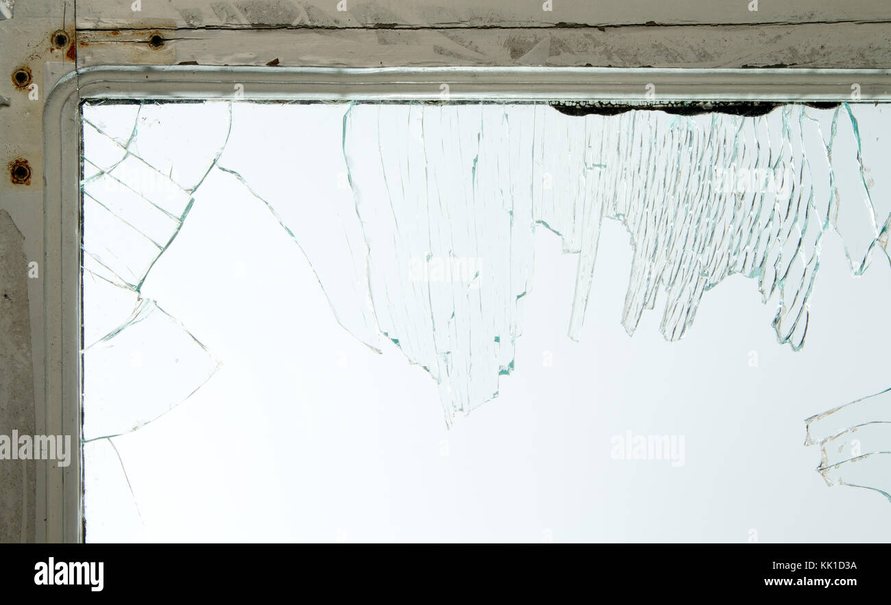 Broken window glass with wooden vintage frame around Stock Photo - Alamy
