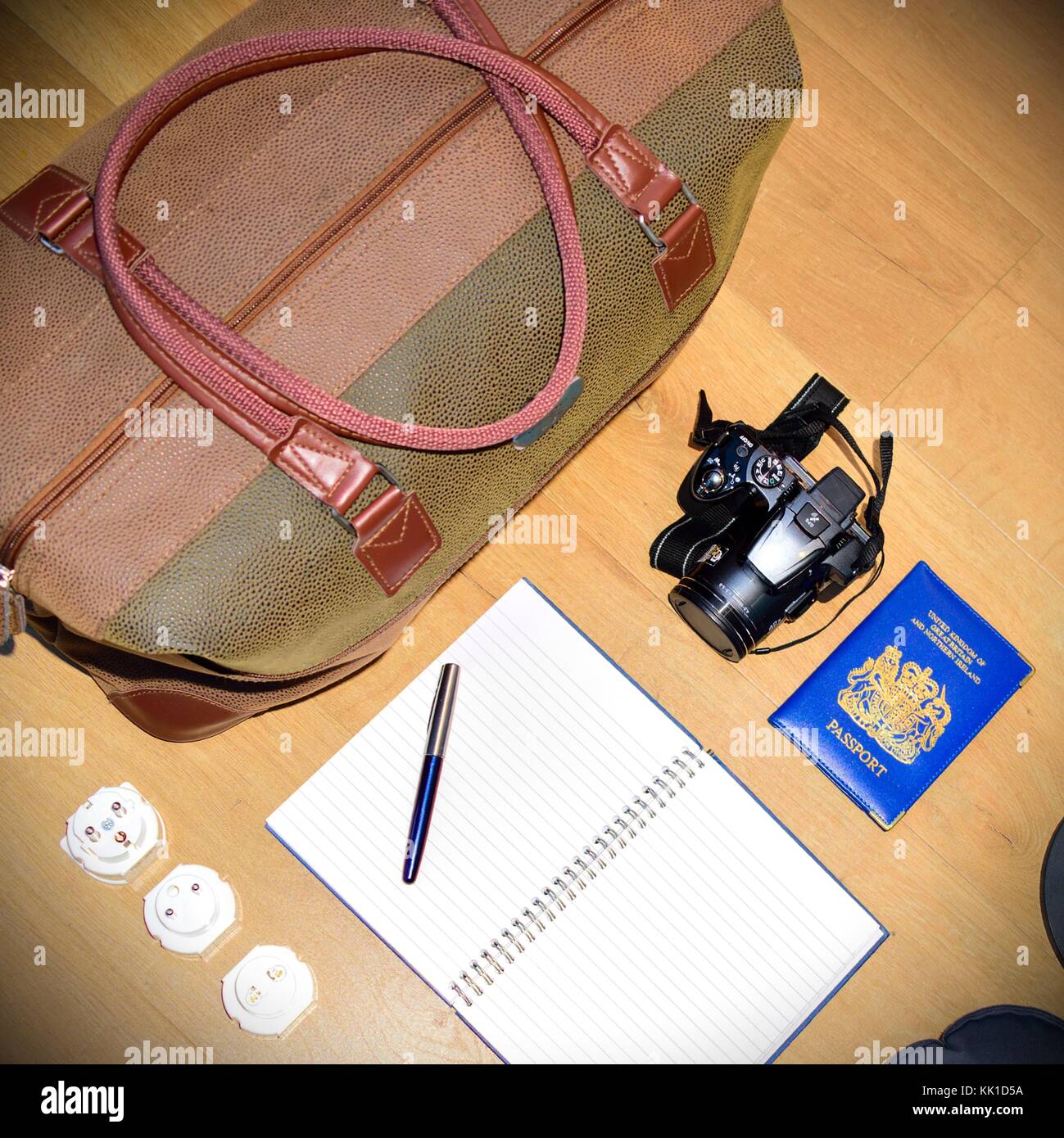 Flat lay of a travel concept, depicting a globe and deciding where to go next.  Creating a bucket list Stock Photo