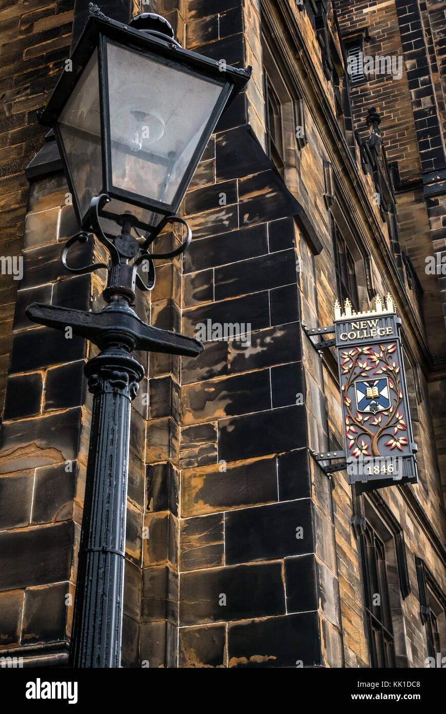 Old fashioned lamp post and decorative 1846 sign, New College, Assembly on The  Mound, University of Edinburgh, previous Free Church of Scotland, UK Stock Photo