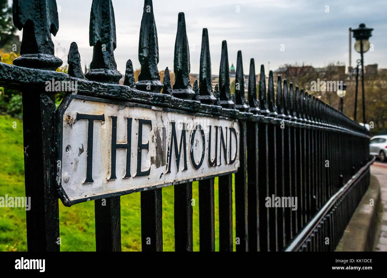 Close up of The Mound street sign on Victorian railings, and ornate Victorian lamp posts, city centre, Edinburgh, Scotland, UK Stock Photo