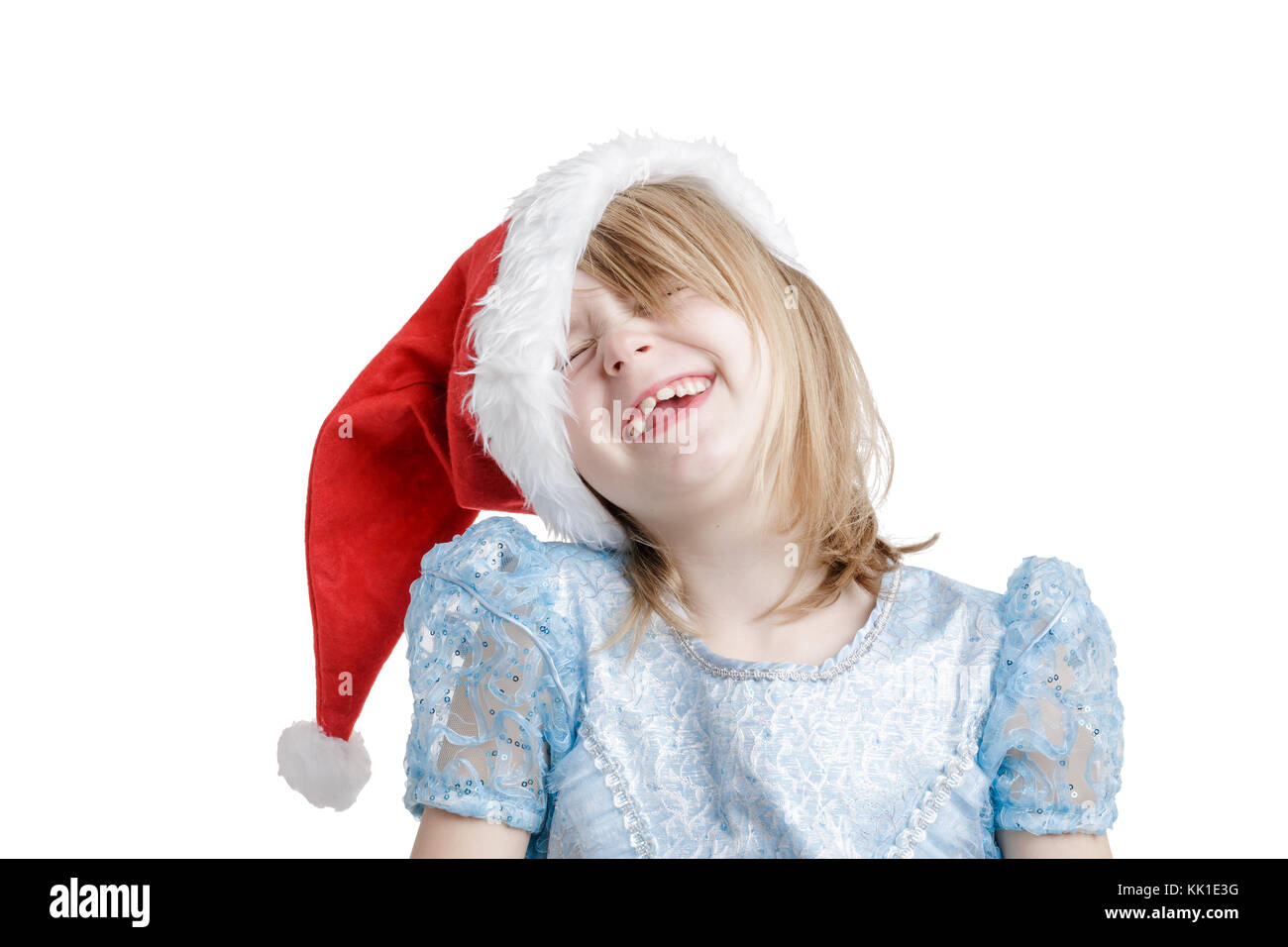 Happy 7-years old girl in Santa Hat Stock Photo