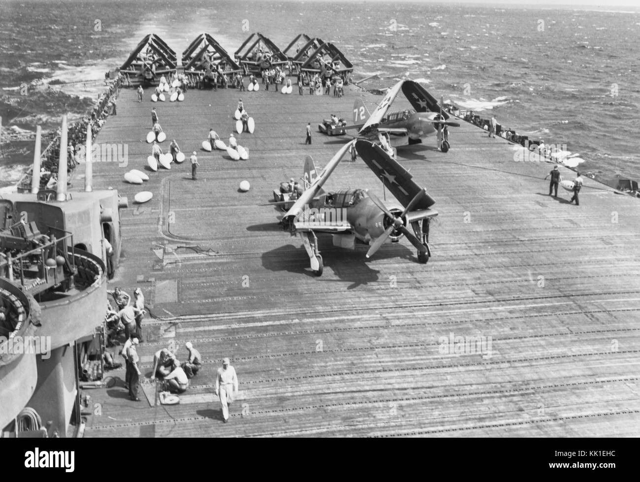 Battle of Leyte Gulf, October 1944. Loading drop tanks on SB2Cs aboard USS LEXINGTON (CV-16) before a search mission, on 25 October 1944. Stock Photo