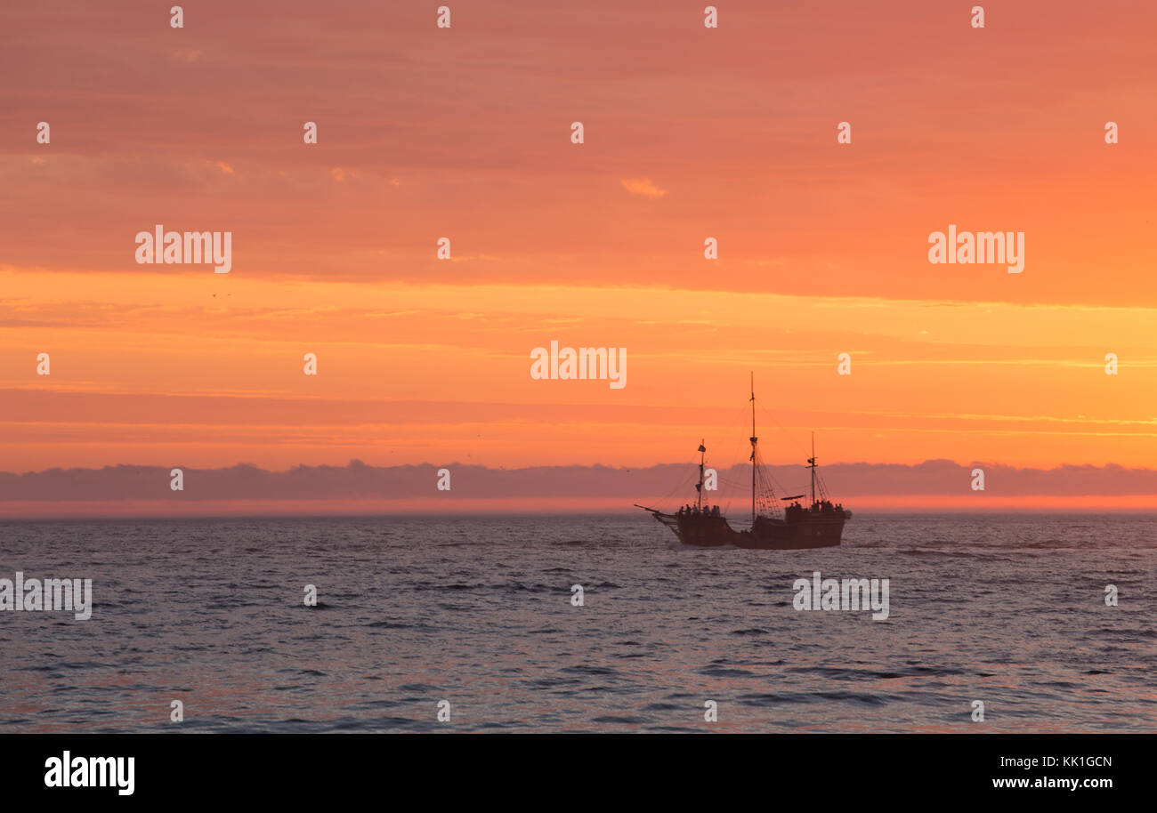boat silhouette at the sea during stunning sunset Stock Photo - Alamy
