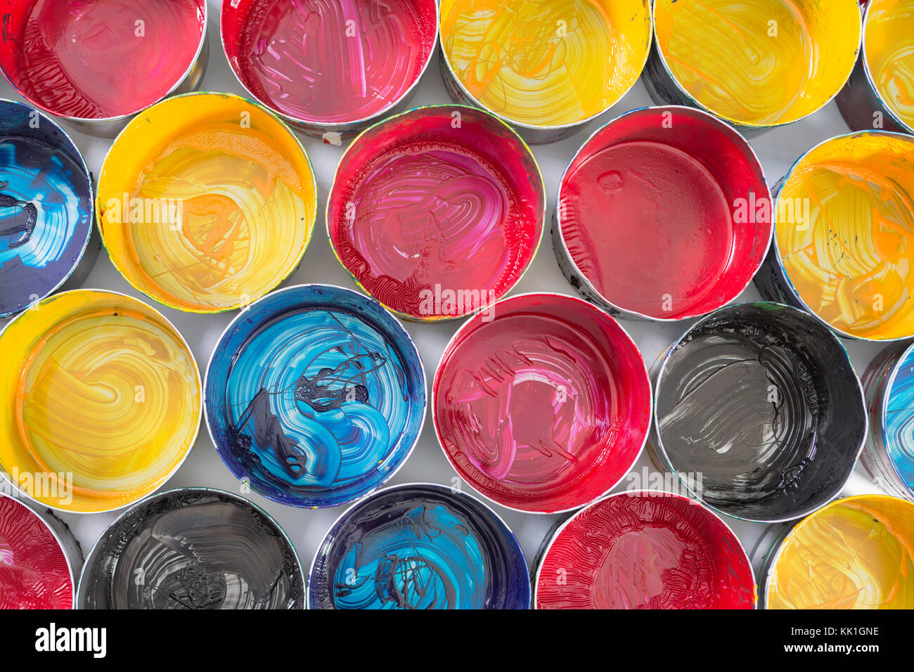 Top view of old CMYK paint cans. Colorful background Stock Photo - Alamy